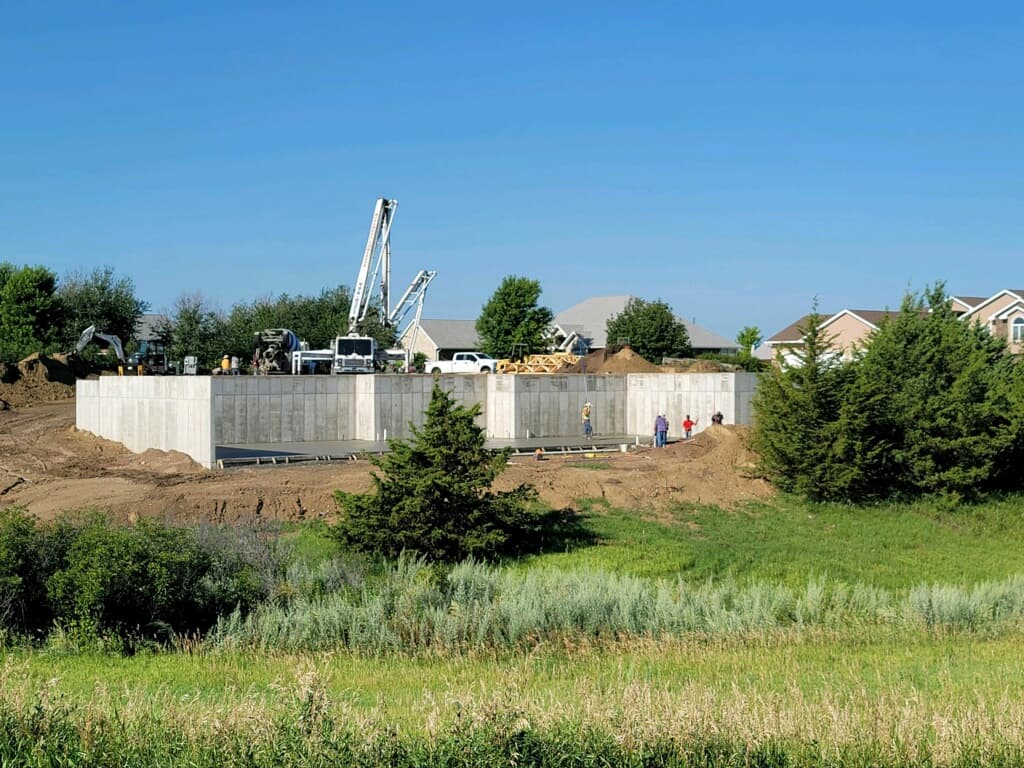 The crew pouring basement walls on a new build