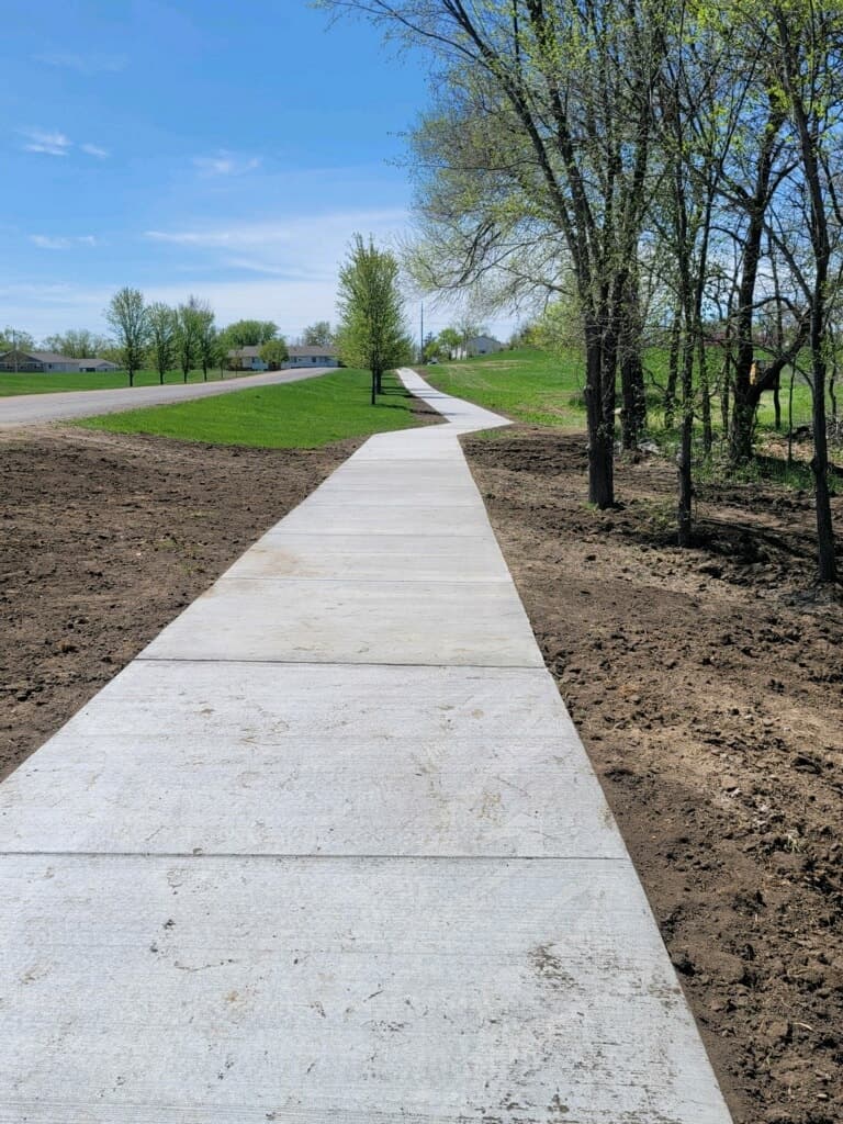 A broom-finished path running the length of the park